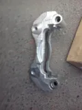 Jarzmo zacisku hamulcowego przedniego Mitsubishi Lancer CSA