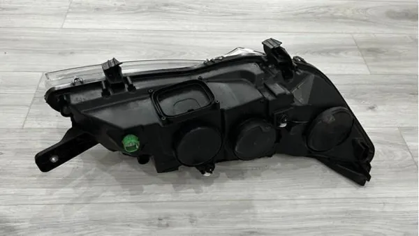 Reflektor lewy 1374296080 Fiat/Alfa/Lancia