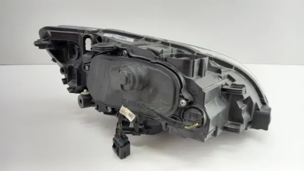 Reflektor lewy 31698818 Volvo