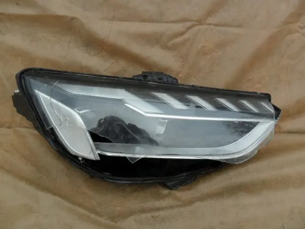 Reflektor lewy 8W0941035 VAG