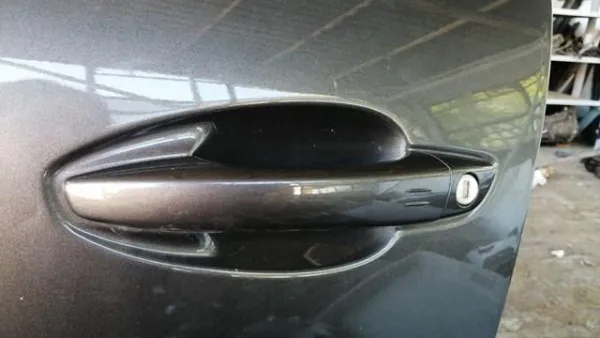 Klamka drzwi przednich zewnętrzna lewa 1614555680 Peugeot/Citroen